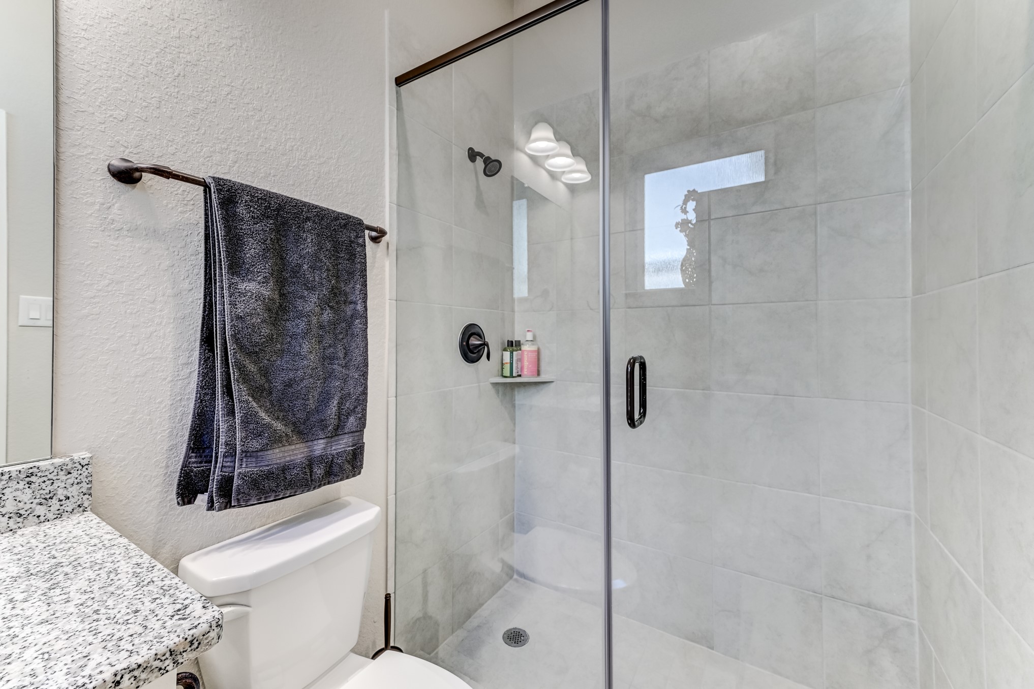 404 Summit Ridge Court Conroe, TX 77318 - Photo 29 of 50 a bathroom with a shower and a toilet