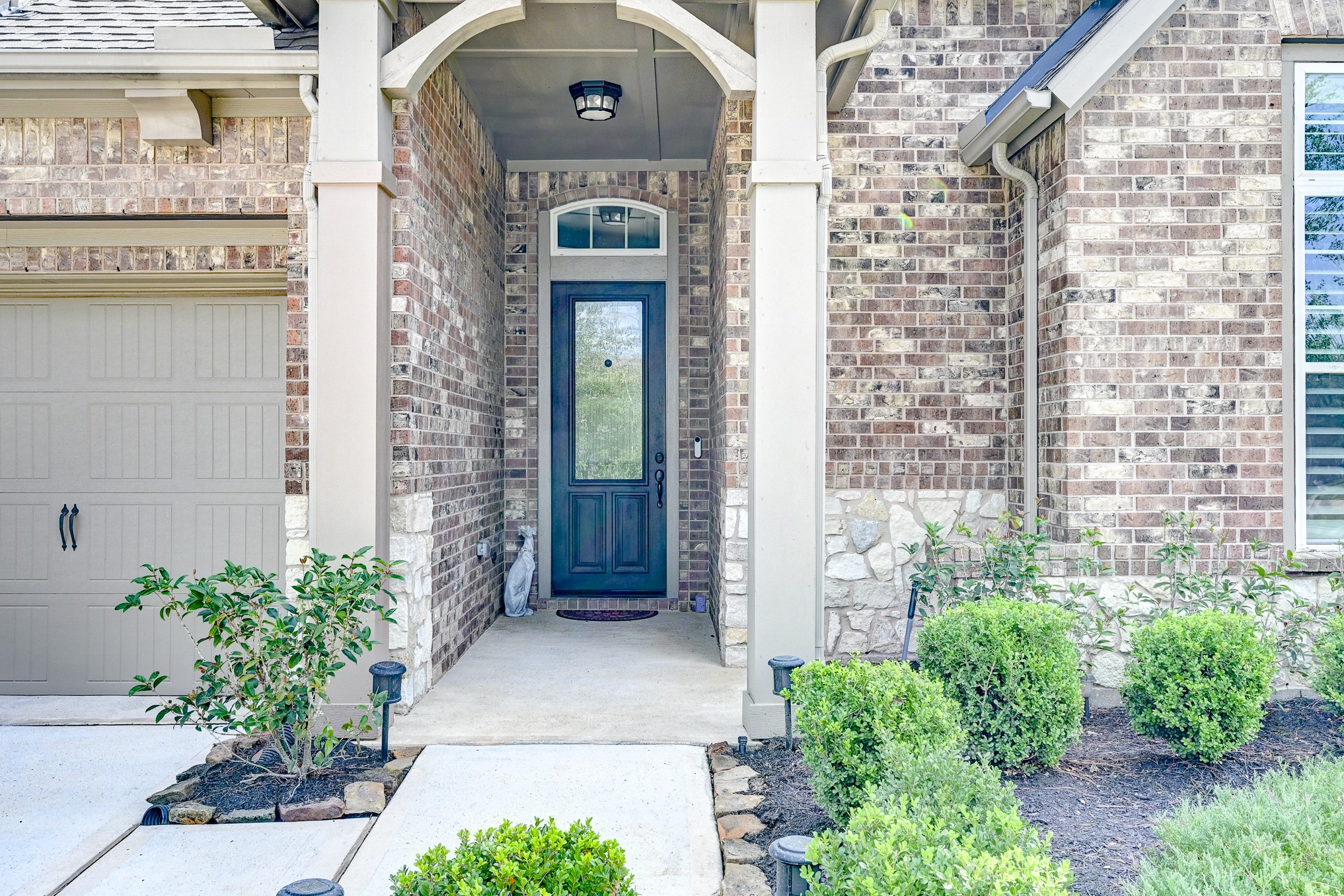 404 Summit Ridge Court Conroe, TX 77318 - Photo 4 of 50 a front view of a house with a yard