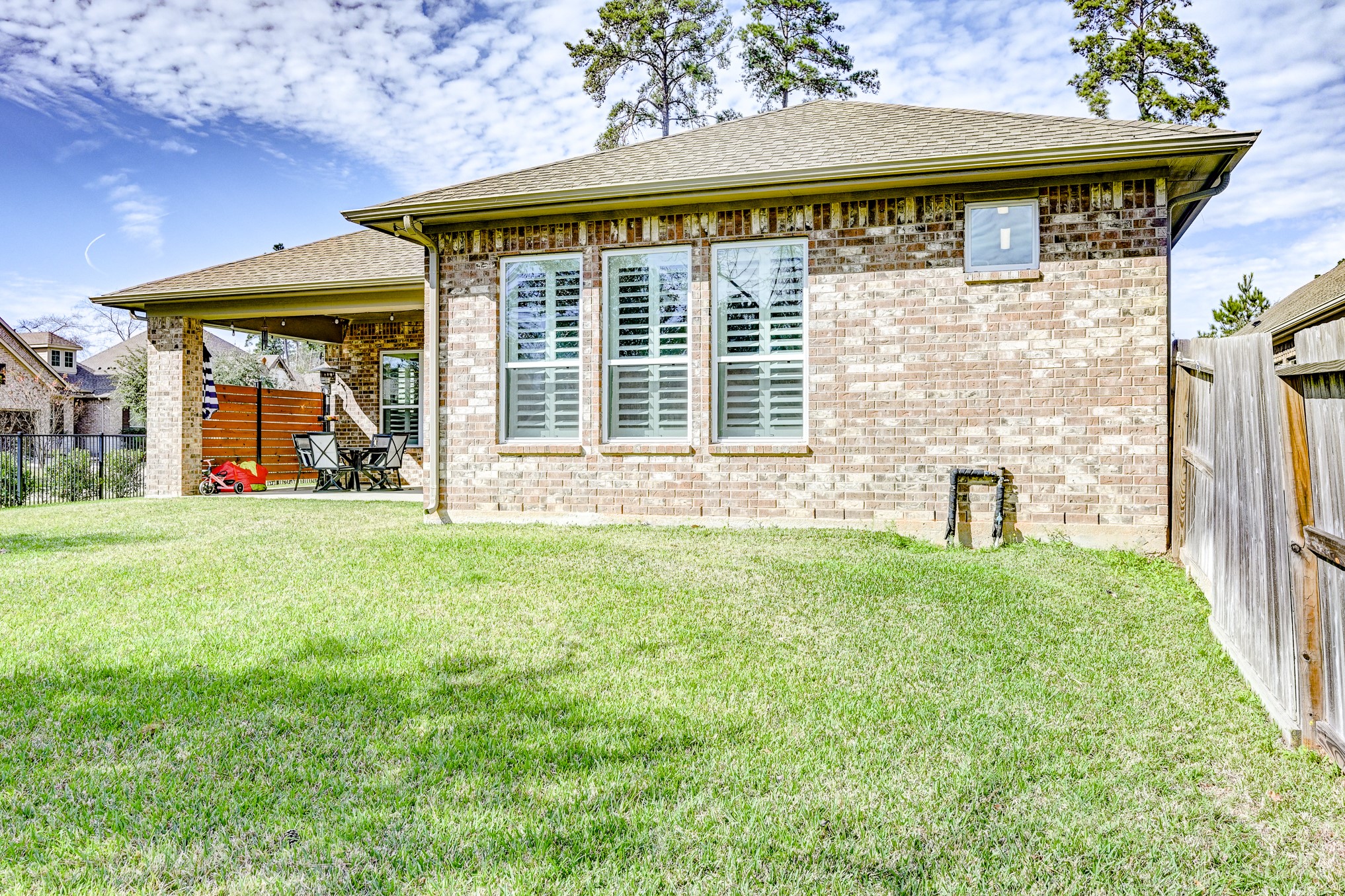 404 Summit Ridge Court Conroe, TX 77318 - Photo 49 of 50 a front view of a house with a yard and garage