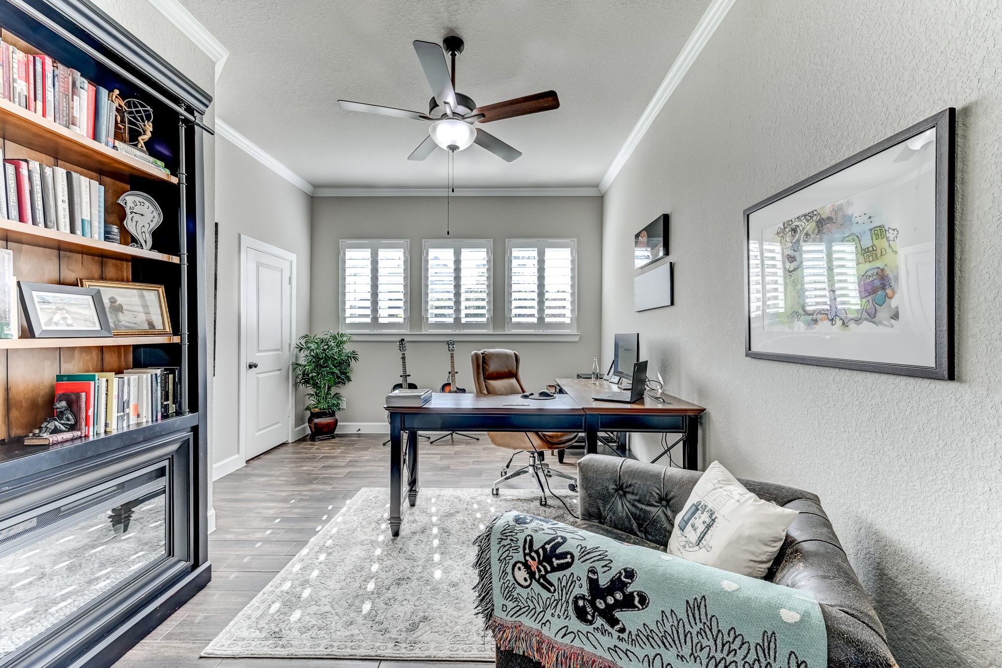 404 Summit Ridge Court Conroe, TX 77318 - Photo 7 of 50 a living room with furniture and a bookshelf