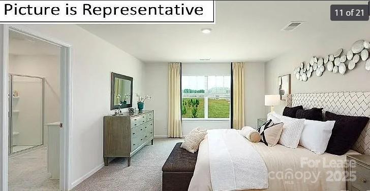 1365 Secrest Cmns Drive Monroe, NC 28112 - Photo 6 of 8 a bedroom with a bed and a large window