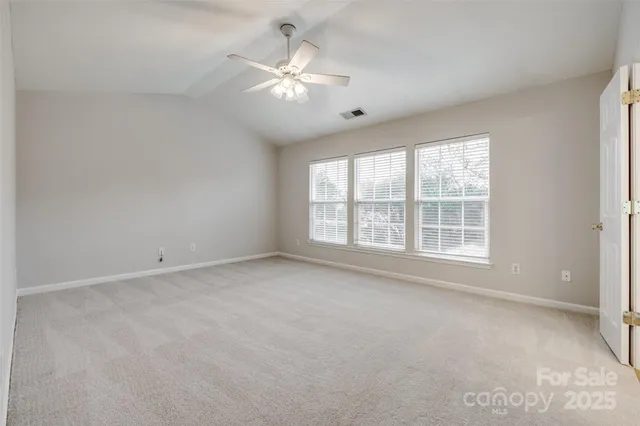 a spacious bathroom with a shower sink and mirror