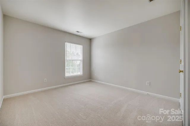 a view of a two chairs in the patio