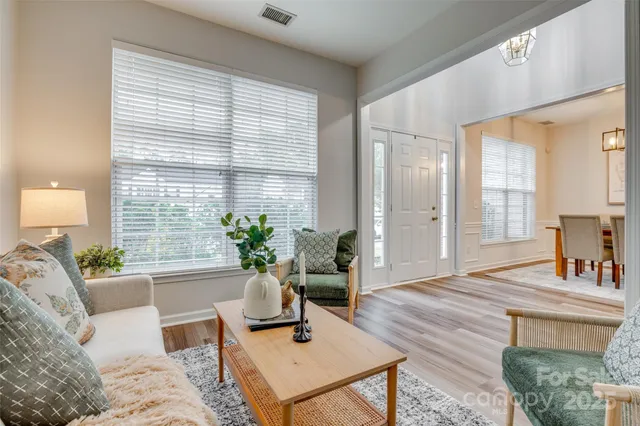 a view of a dining room with furniture window and wooden floor