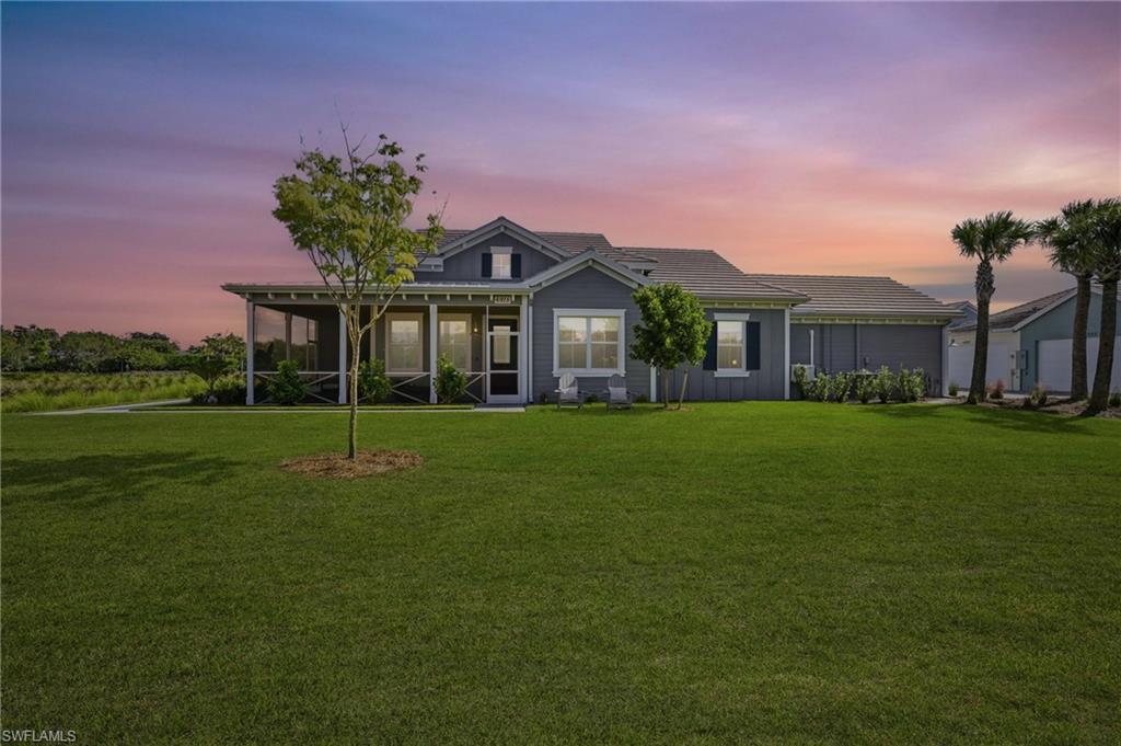 a front view of house with yard and green space