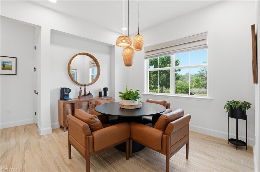 6975 Saona Court Naples, FL 34113 - Photo 11 of 30 a living room with furniture and a window