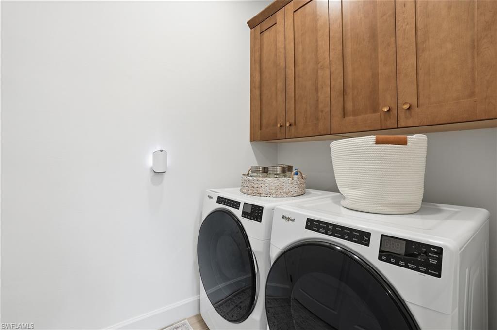 6975 Saona Court Naples, FL 34113 - Photo 19 of 30 a utility room with dryer and washer