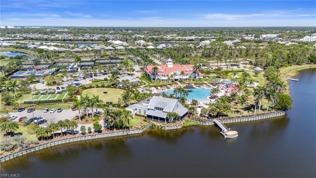 6975 Saona Court Naples, FL 34113 - Photo 24 of 30 an aerial view of residential houses with outdoor space and lake view