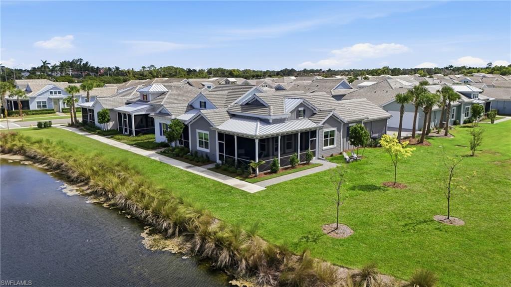 6975 Saona Court Naples, FL 34113 - Photo 25 of 30 an aerial view of a house with a garden