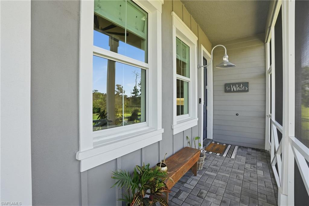 6975 Saona Court Naples, FL 34113 - Photo 26 of 30 a view of front door of house