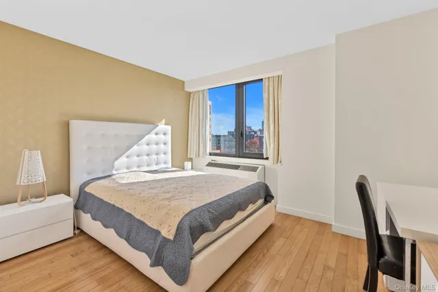 a kitchen that has a stove and a wooden floor