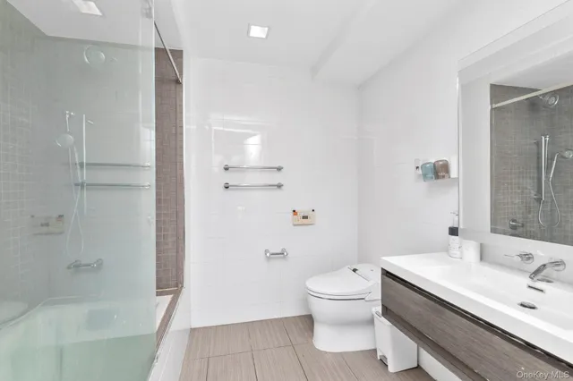 a bedroom with a bed and a chair