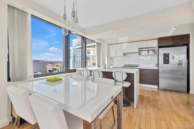 a kitchen with a table chairs and microwave