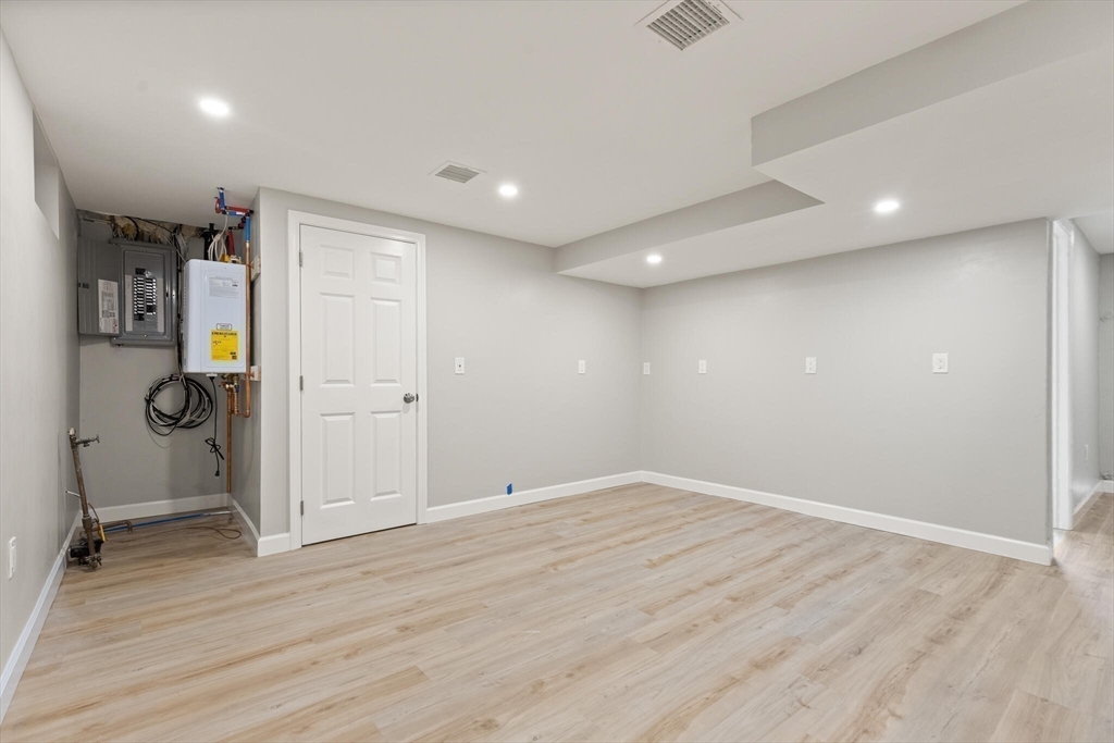 80 Newhall Street Lynn, MA 01902 - Photo 13 of 16 wooden floor in an empty room