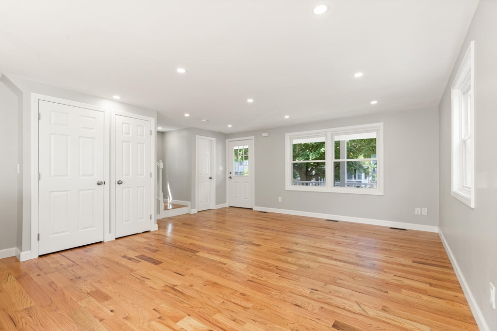 80 Newhall Street Lynn, MA 01902 - Photo 9 of 16 a view of an empty room with wooden floor and a window