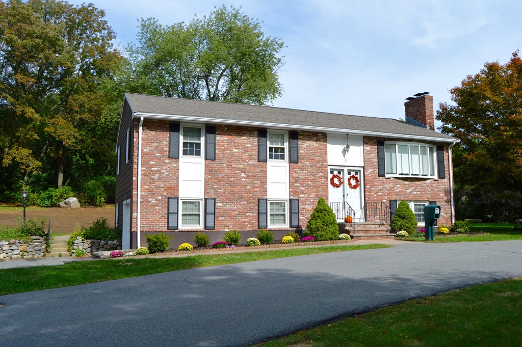 1 Rutgers Road Andover, MA 01810 - Photo 1 of 18 a front view of a house with a yard and trees