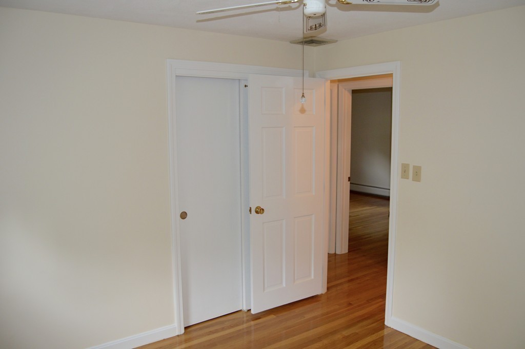 1 Rutgers Road Andover, MA 01810 - Photo 12 of 18 a view of a hallway with wooden floor
