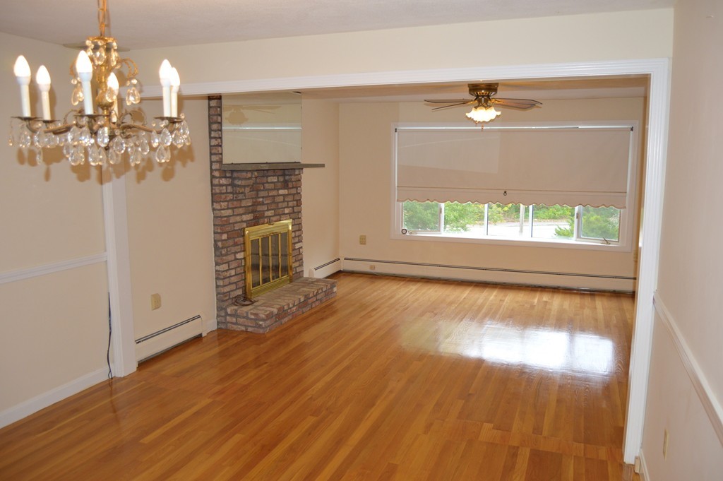1 Rutgers Road Andover, MA 01810 - Photo 4 of 18 a view of empty room with window and wooden floor