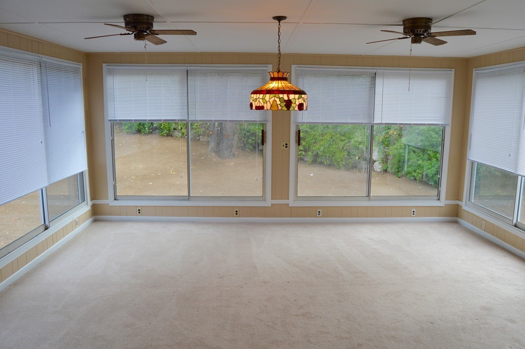1 Rutgers Road Andover, MA 01810 - Photo 8 of 18 a view of a livingroom with a chandelier fan