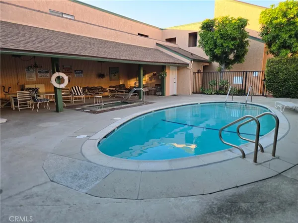 a view of swimming pool with outdoor seating