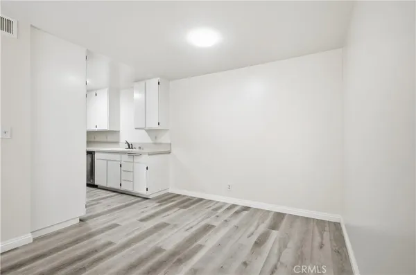 a view of kitchen with wooden floor