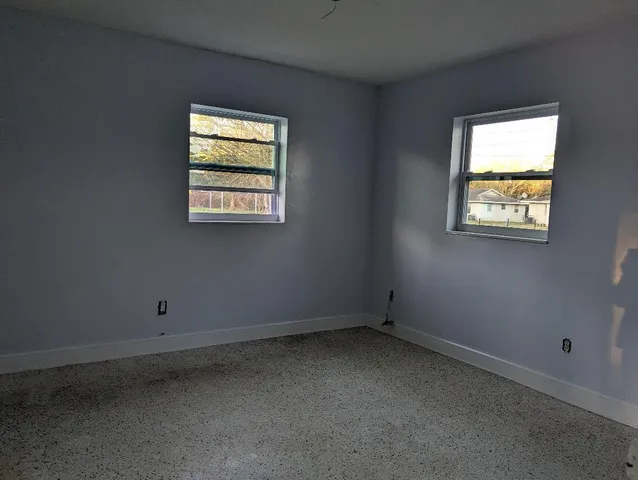 an empty room with windows