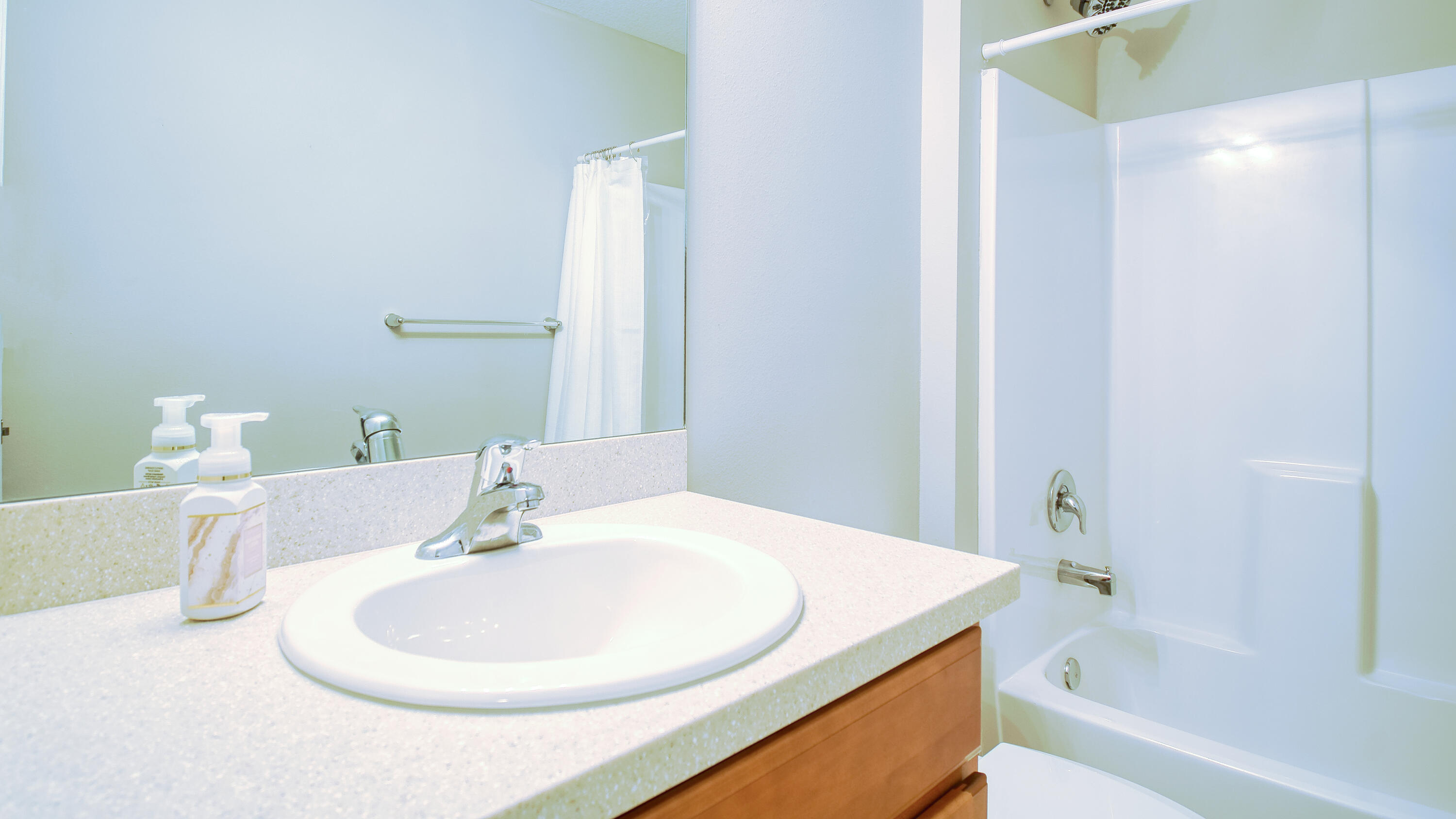 1780 Southwest Leafy Road Port St. Lucie, FL 34953 - Photo 23 of 30 a bathroom with a sink and a bathtub