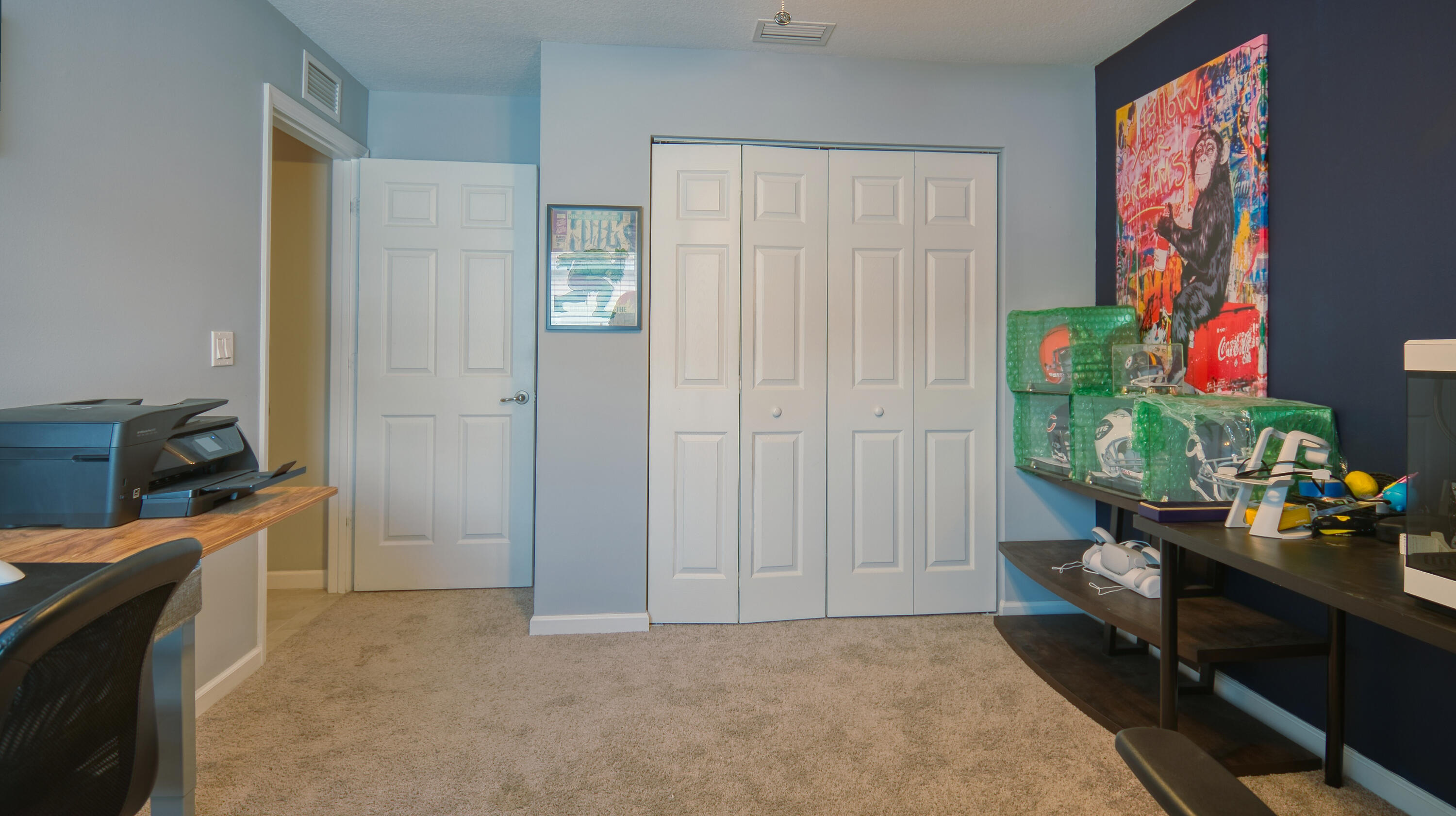 1780 Southwest Leafy Road Port St. Lucie, FL 34953 - Photo 25 of 30 a hallway with a dining table and a workspace