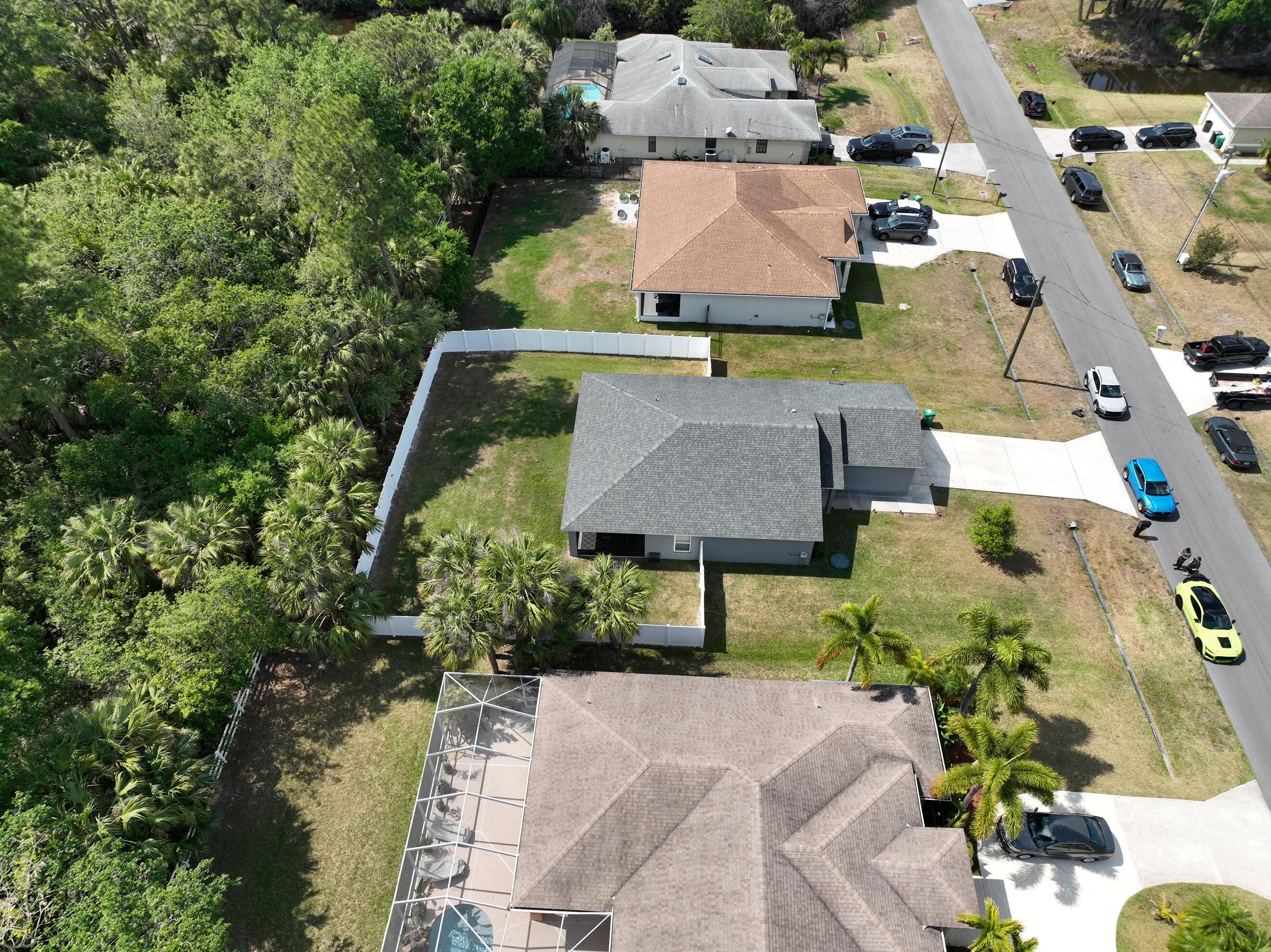 1780 Southwest Leafy Road Port St. Lucie, FL 34953 - Photo 30 of 30 an aerial view of a house with yard swimming pool and outdoor seating