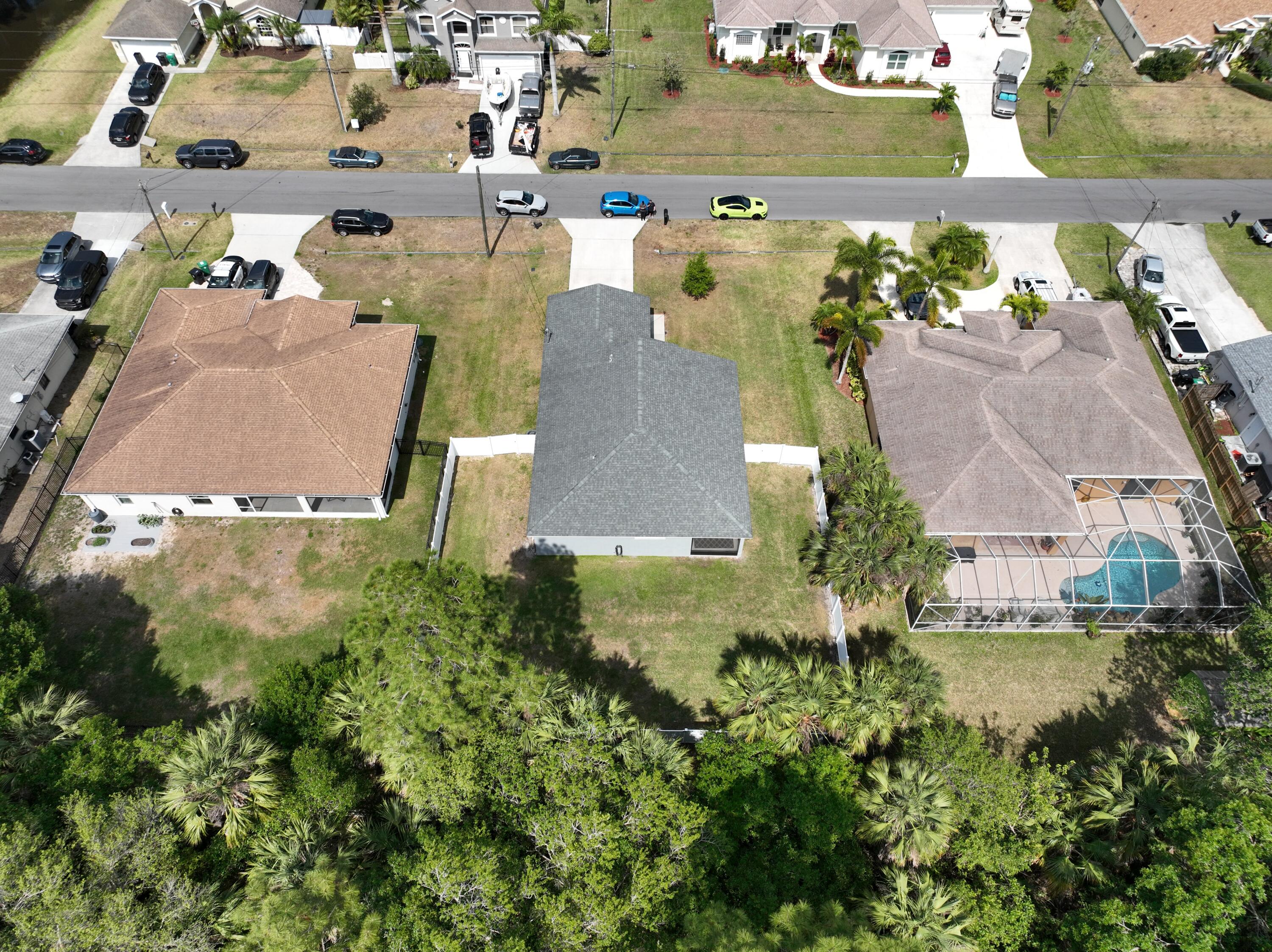 1780 Southwest Leafy Road Port St. Lucie, FL 34953 - Photo 6 of 30 an aerial view of a house with a yard