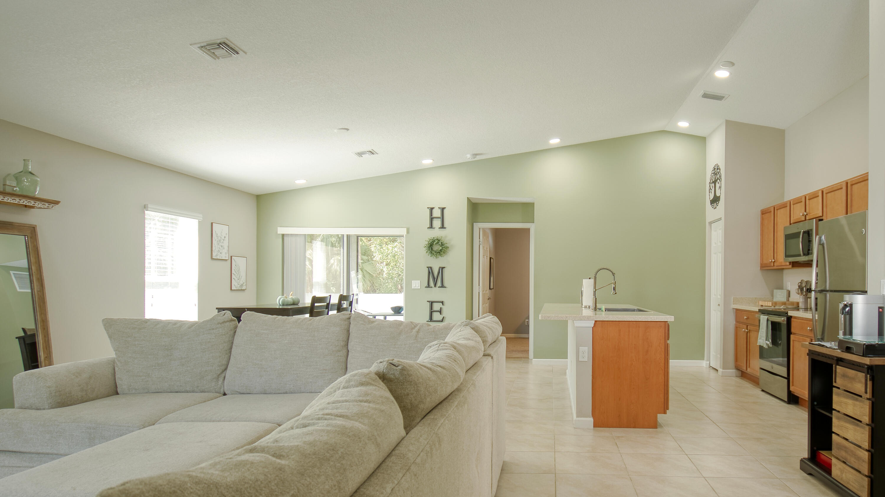 1780 Southwest Leafy Road Port St. Lucie, FL 34953 - Photo 7 of 30 a living room with furniture and a large window