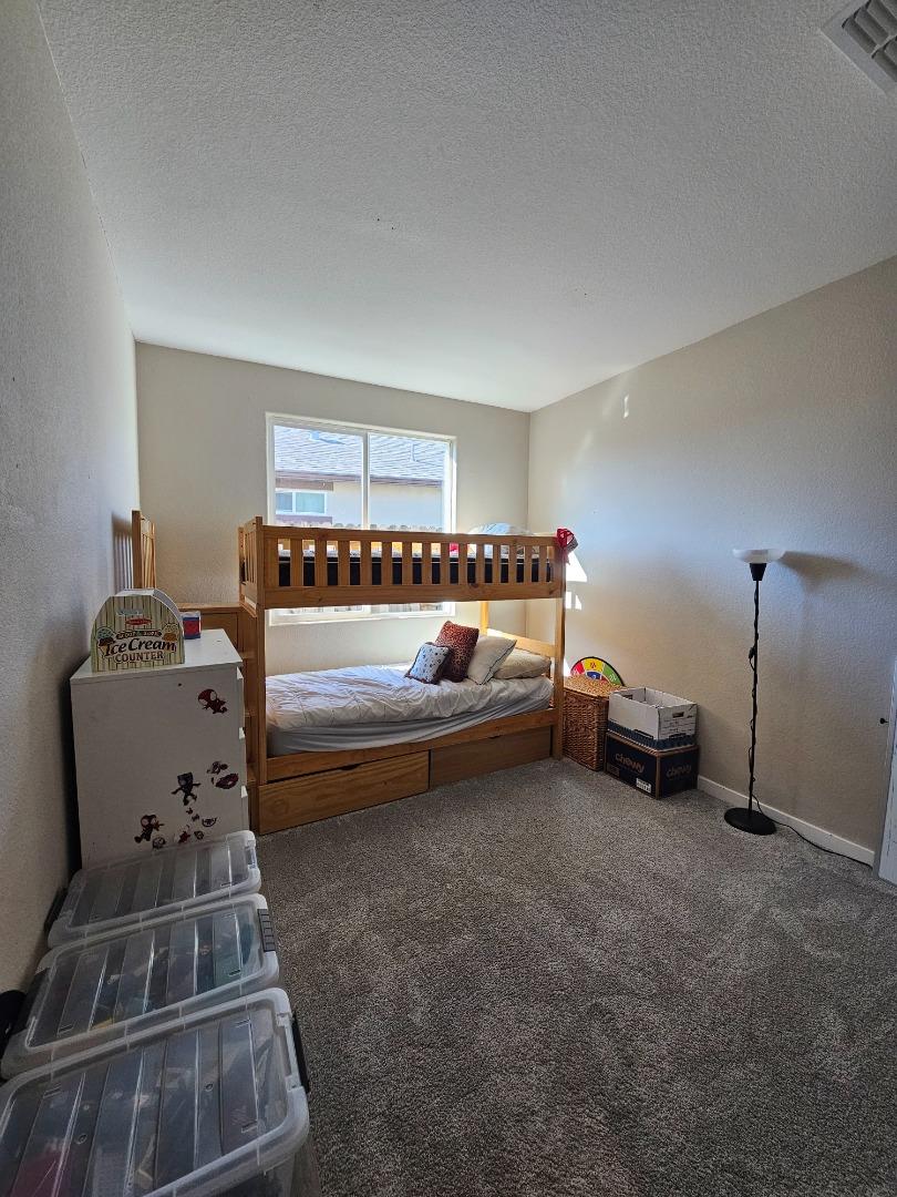 184 Raccoon Hollow Loop Copperopolis, CA 95228 - Photo 5 of 8 a bedroom with furniture and a window