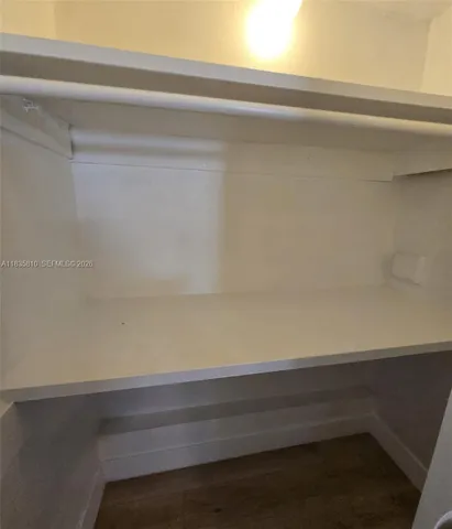 a view of a backyard with large trees