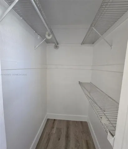 a view of a room with racks on the wall