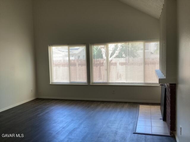 44745 Christie Avenue Lancaster, CA 93535 - Photo 2 of 18 a room with wooden floor and a window