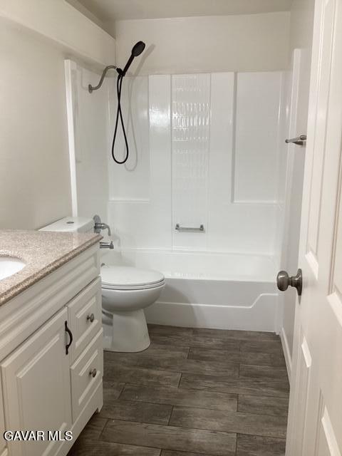 44745 Christie Avenue Lancaster, CA 93535 - Photo 9 of 18 a bathroom with a granite countertop toilet a sink and a shower