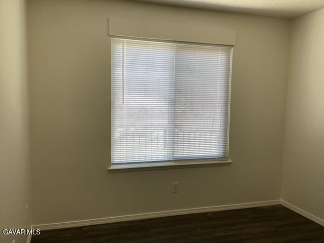 44745 Christie Avenue Lancaster, CA 93535 - Photo 10 of 18 a view of a small space with wooden floor and a window