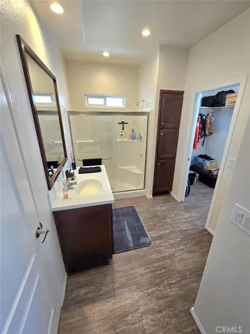 a view of a hallway with storage and utility room