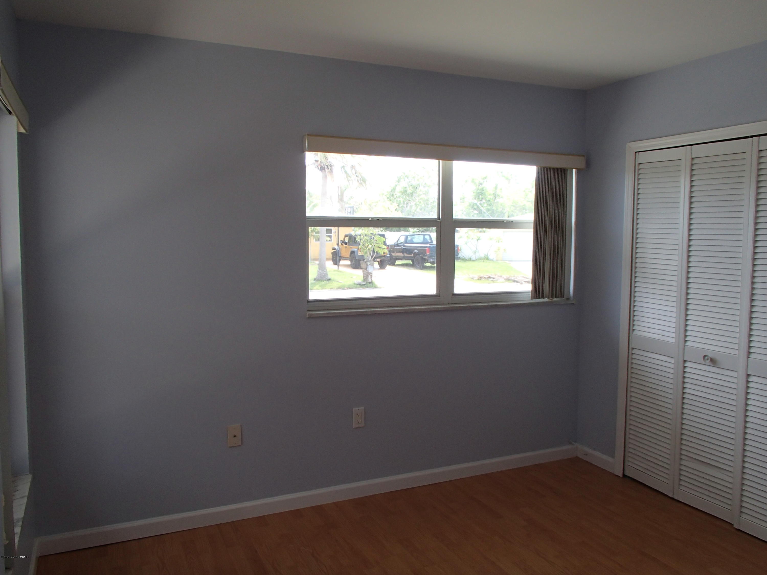 703 Bermuda Road Cocoa Beach, FL 32931 - Photo 12 of 19 an empty room with a window