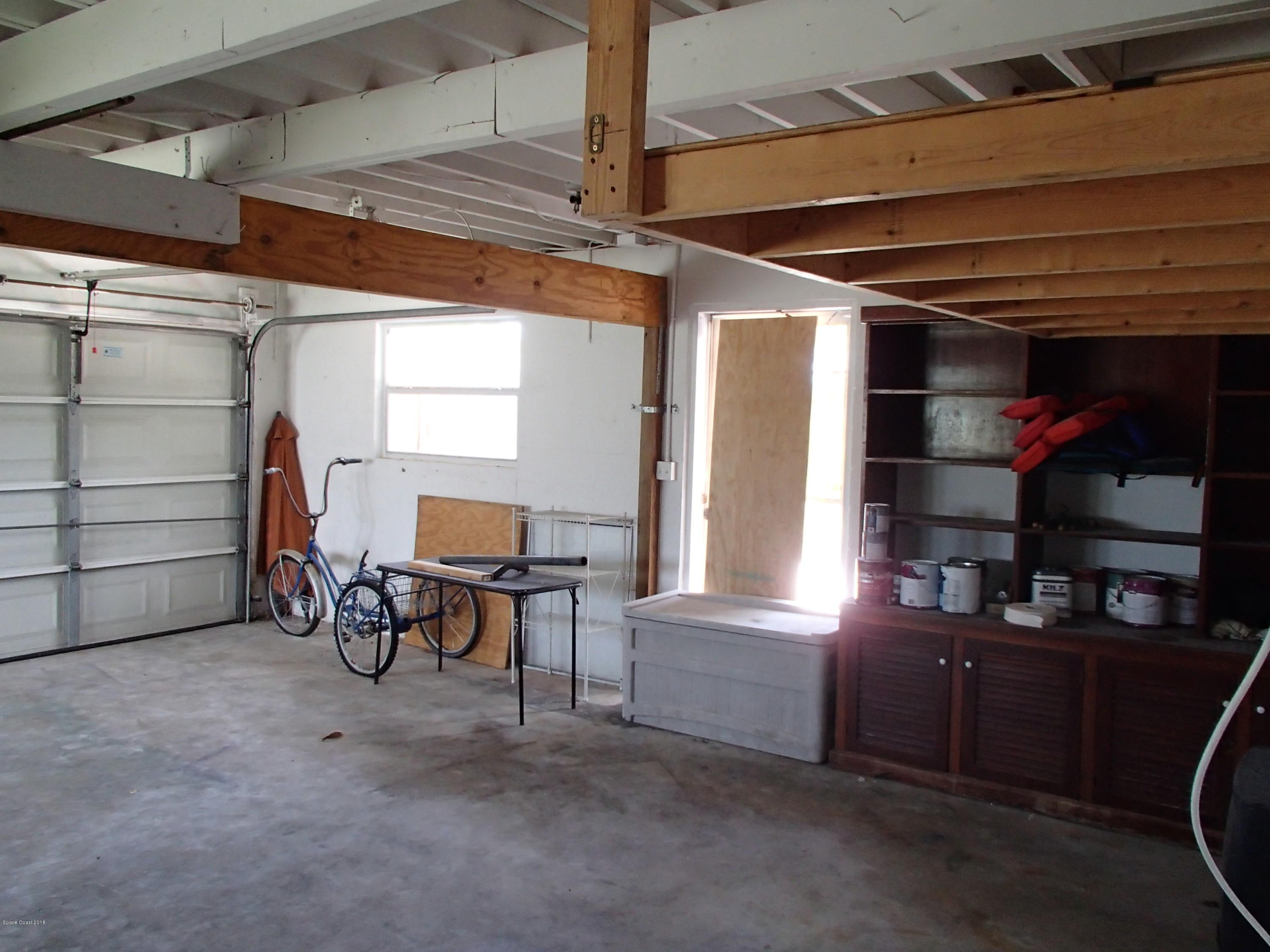 703 Bermuda Road Cocoa Beach, FL 32931 - Photo 18 of 19 a view of a storage & utility room