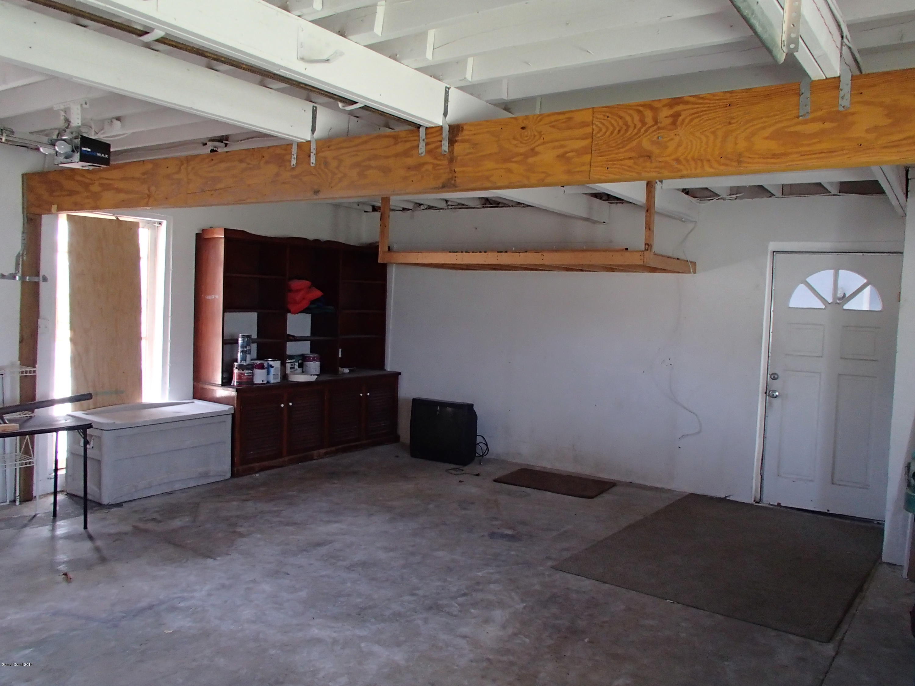 703 Bermuda Road Cocoa Beach, FL 32931 - Photo 19 of 19 a living room with furniture