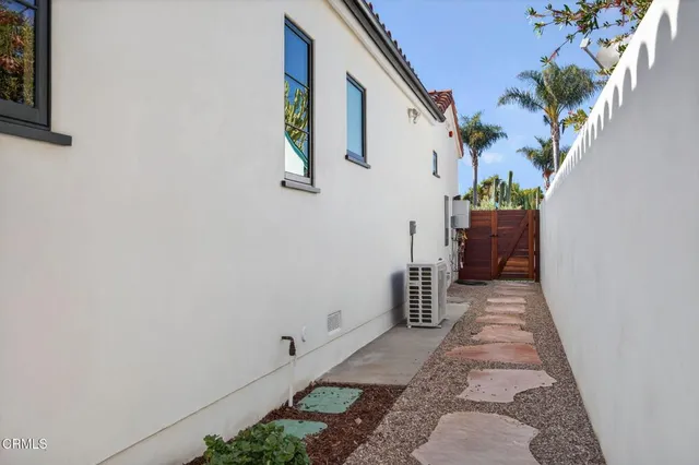 a view of a dry yard with trees