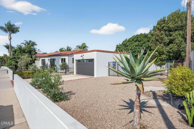 a front view of a house with yard
