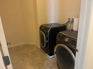 an entryway with wooden floor