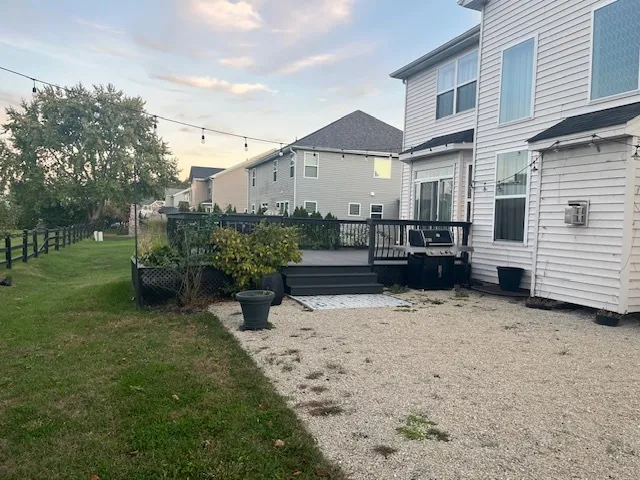 a view of a chairs and table on the deck