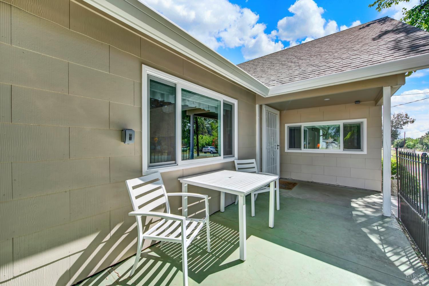 4851 Udell Road Vacaville, CA 95688 - Photo 6 of 65 a balcony with table and chairs