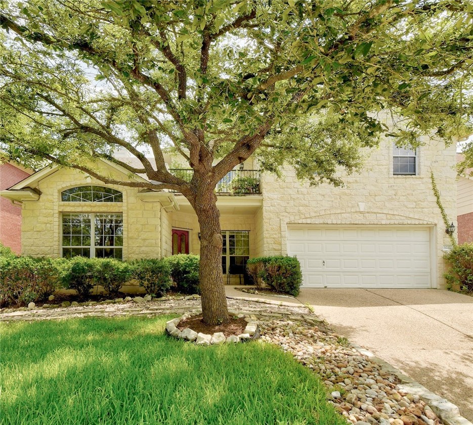 All sides white stone, 3225 Grimes Ranch Road is a spacious three bedroom home