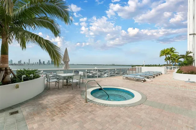 a view of a swimming pool with a patio