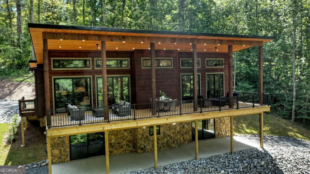 a view of an chairs and table in a patio