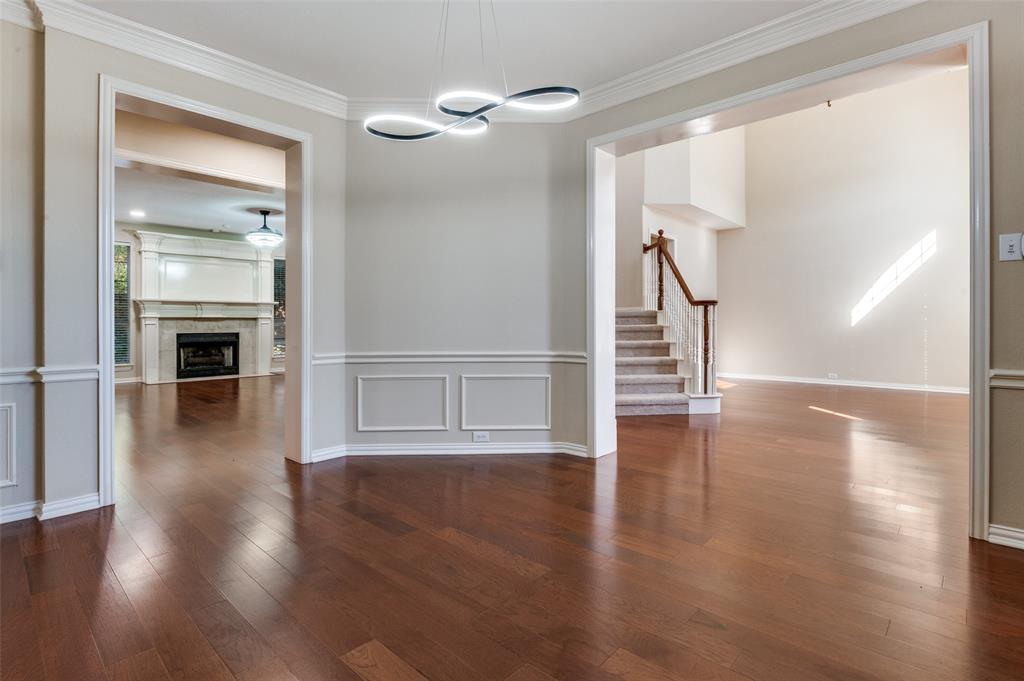 602 Signet Court Keller, TX 76248 - Photo 2 of 30 a view of a hallway with wooden floor staircase and a living room